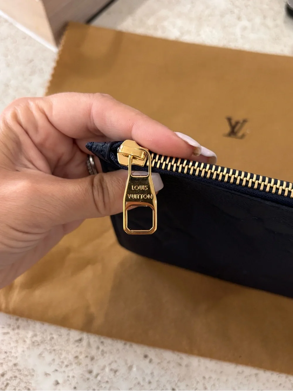 Authentic Louis Vuitton Neverfull GM Empreinte giant monogram pouch wristlet